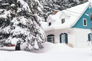 A big house covered with white snow during winter