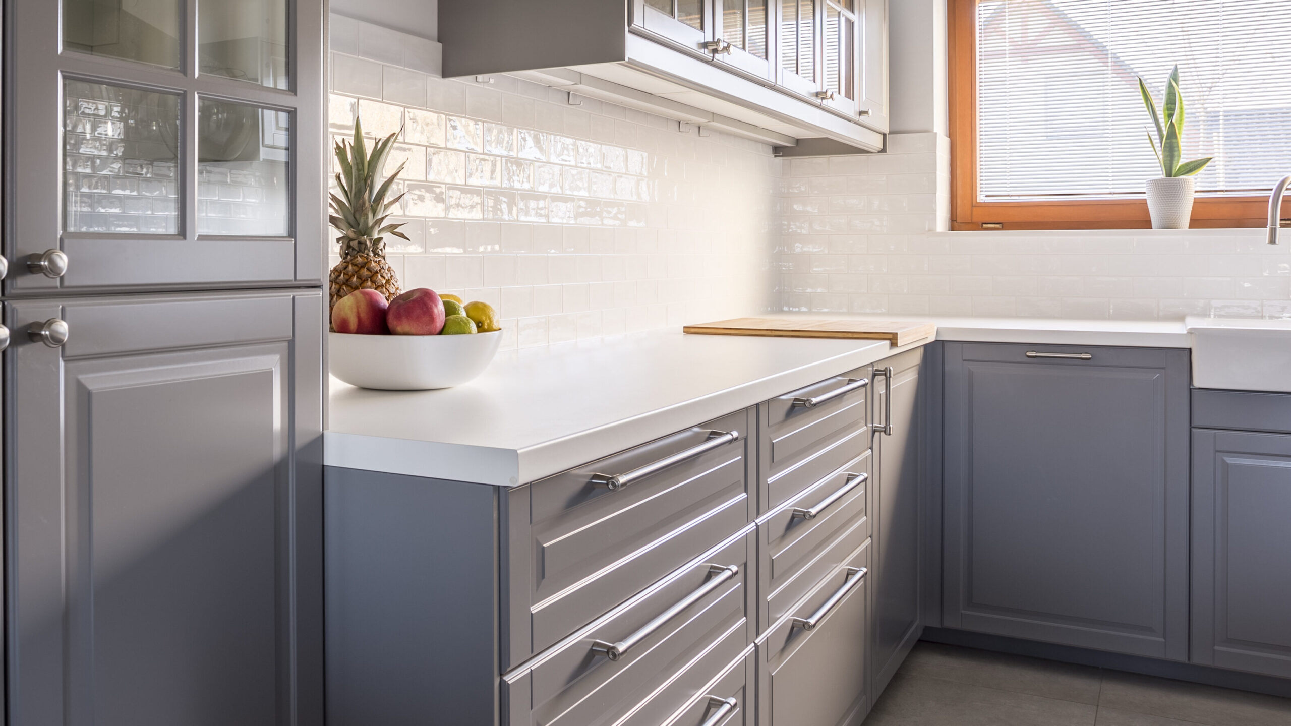 Up-to-date design of cooking space with grey units