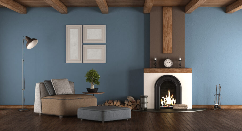Blue and brown living room with fireplace and armchairs