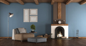 Blue and brown living room with fireplace and armchairs