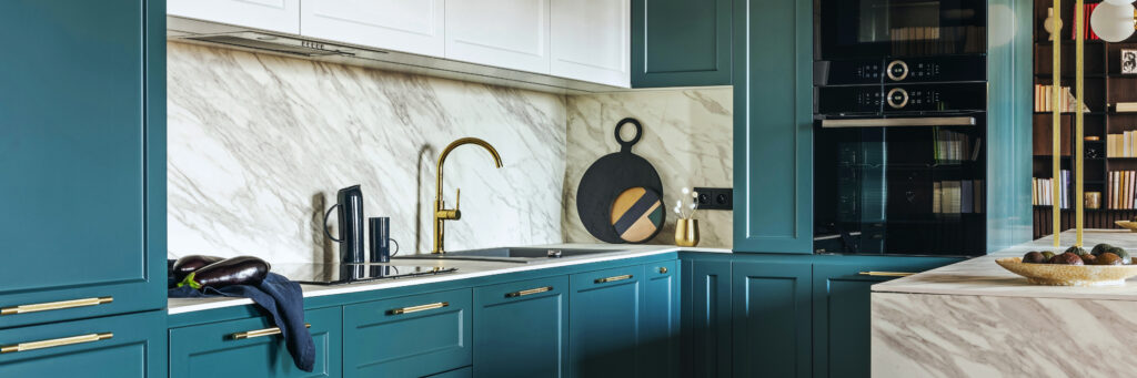 Luxury modern and vintage turquoise and white kitchen. Marble kitchen island with white owal chandelier . Gold tap on marble table top. Template.